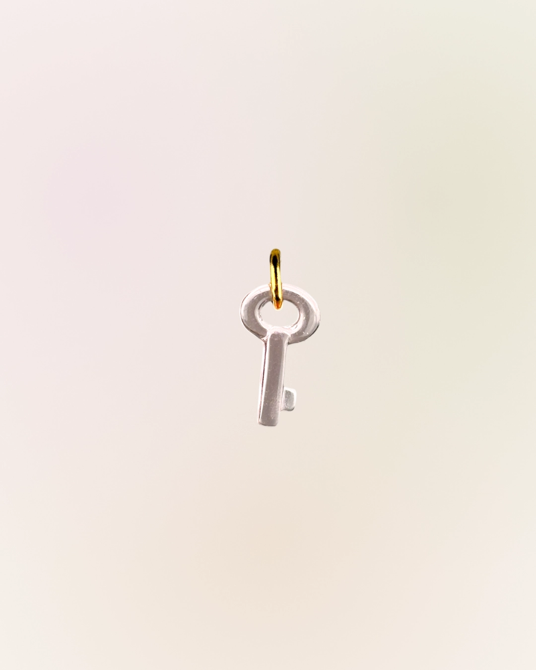 Charm clé rose